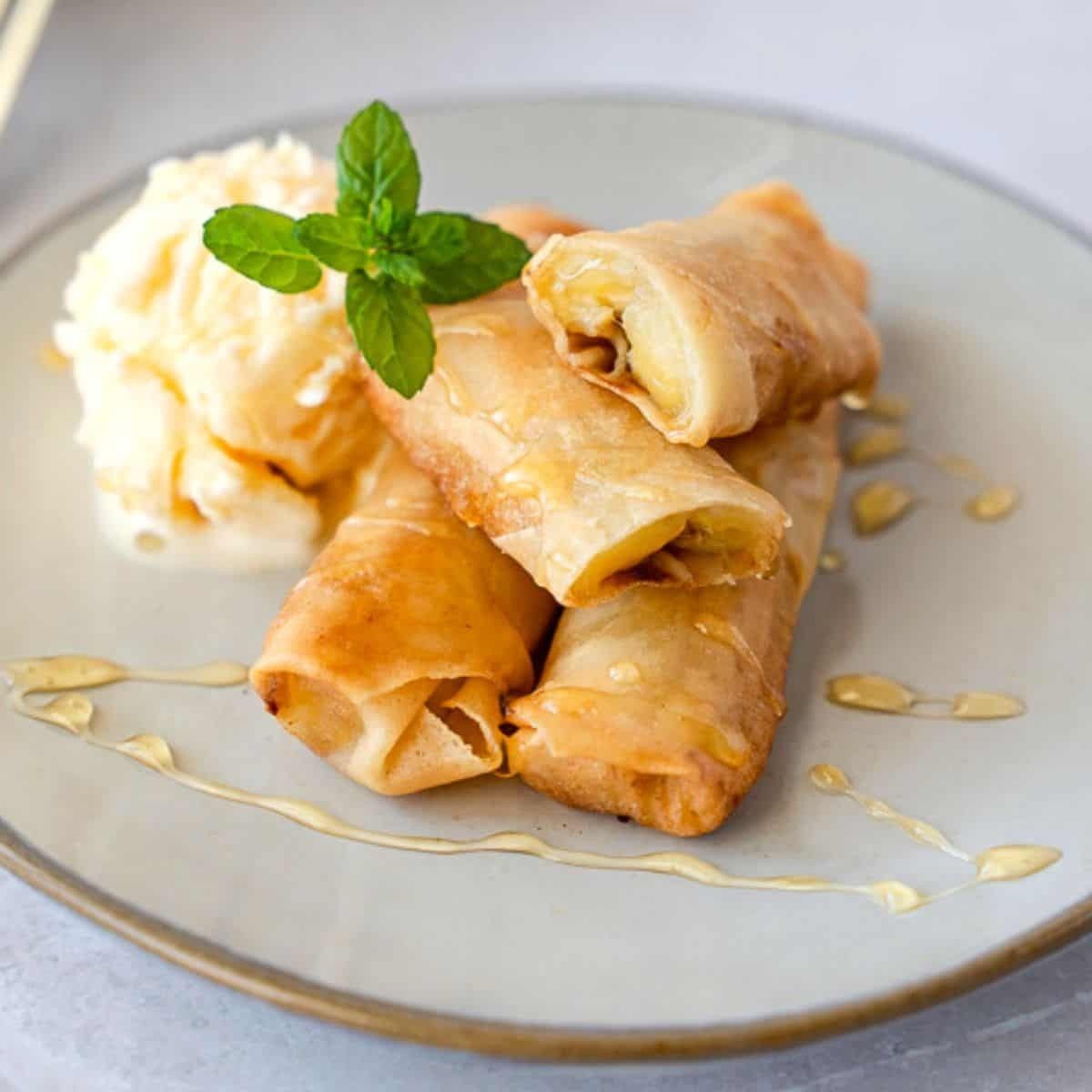 Banana Spring Roll, honey sesame sauce, served with vanilla ice cream