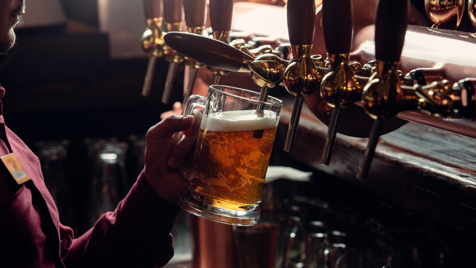 Bartender pouring lager into a mug