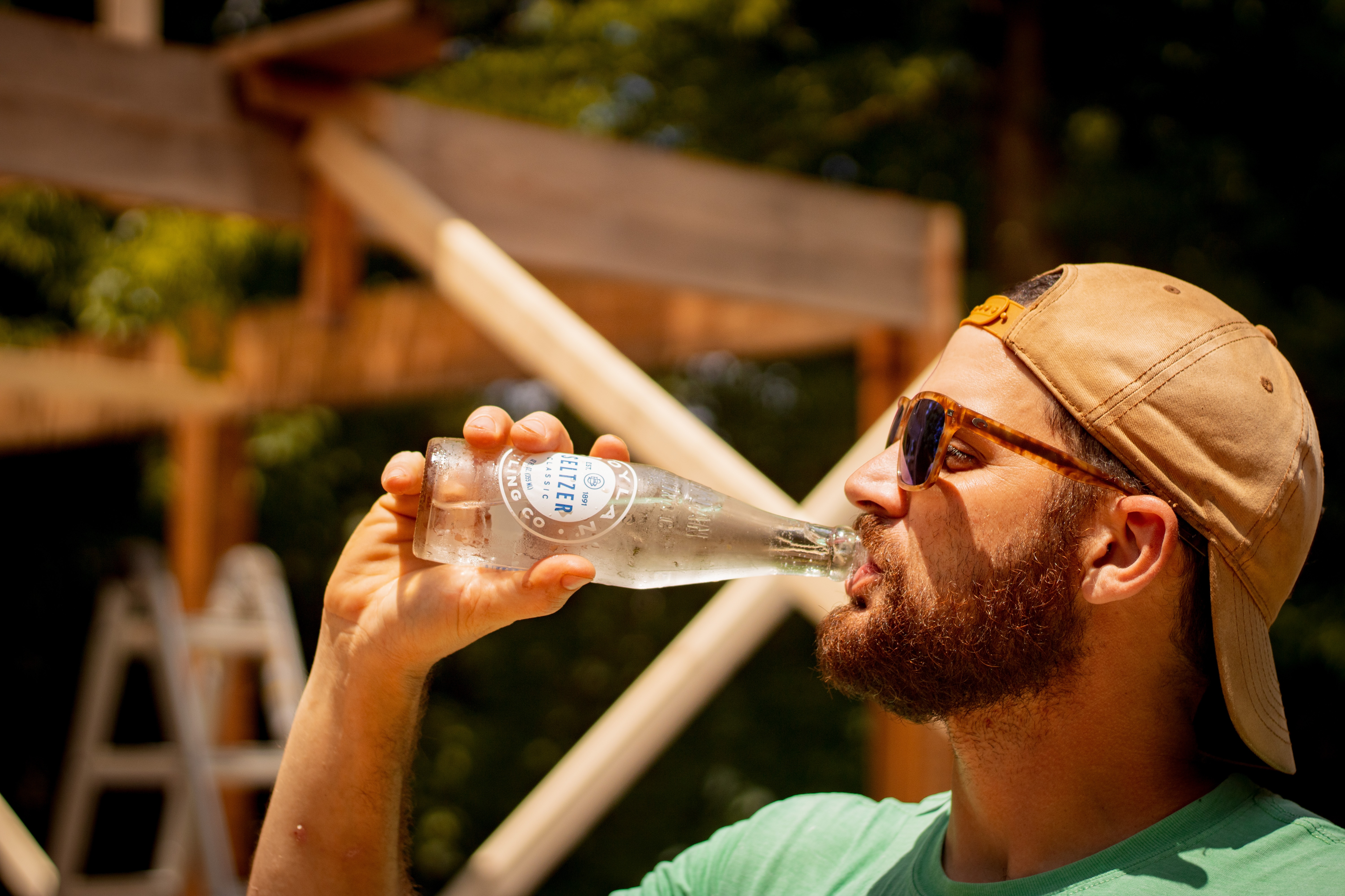 man drinking bite of beer